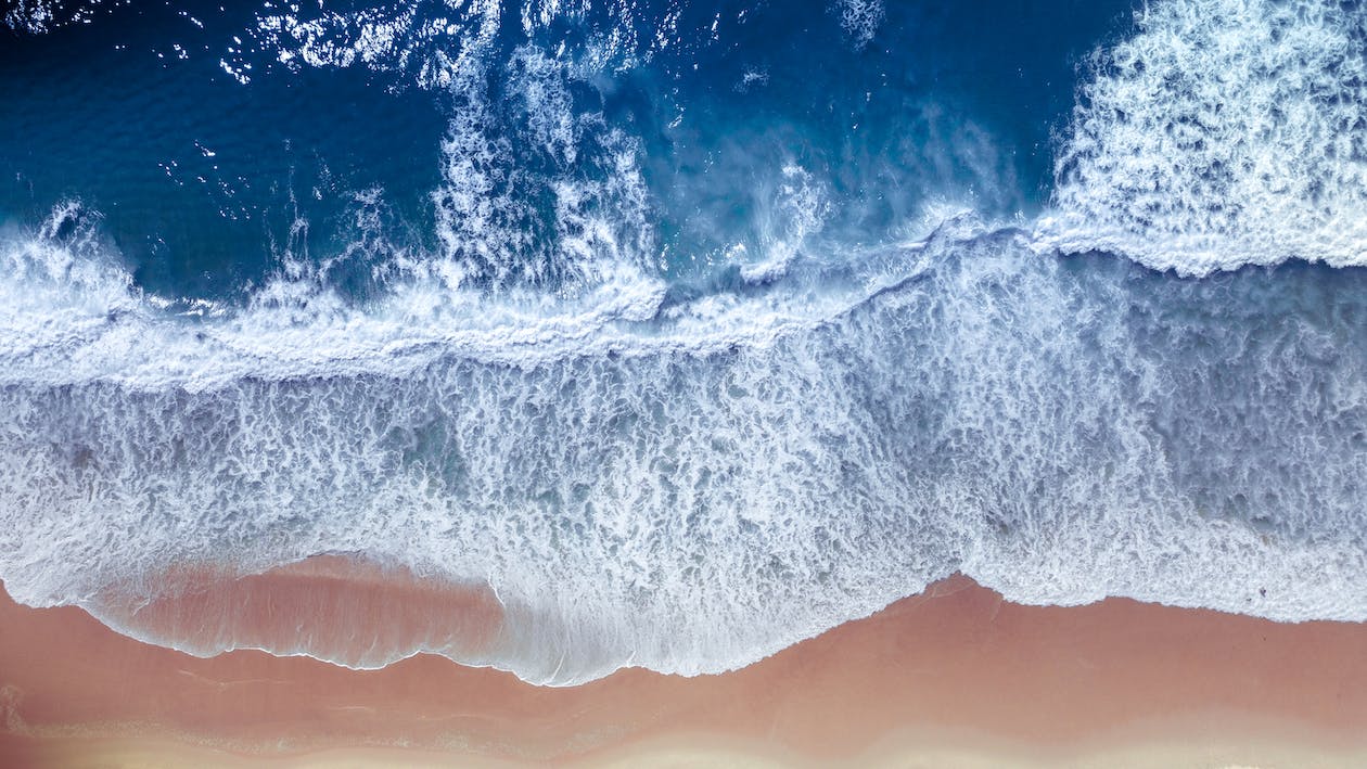 Why do waves always come towards the beach?